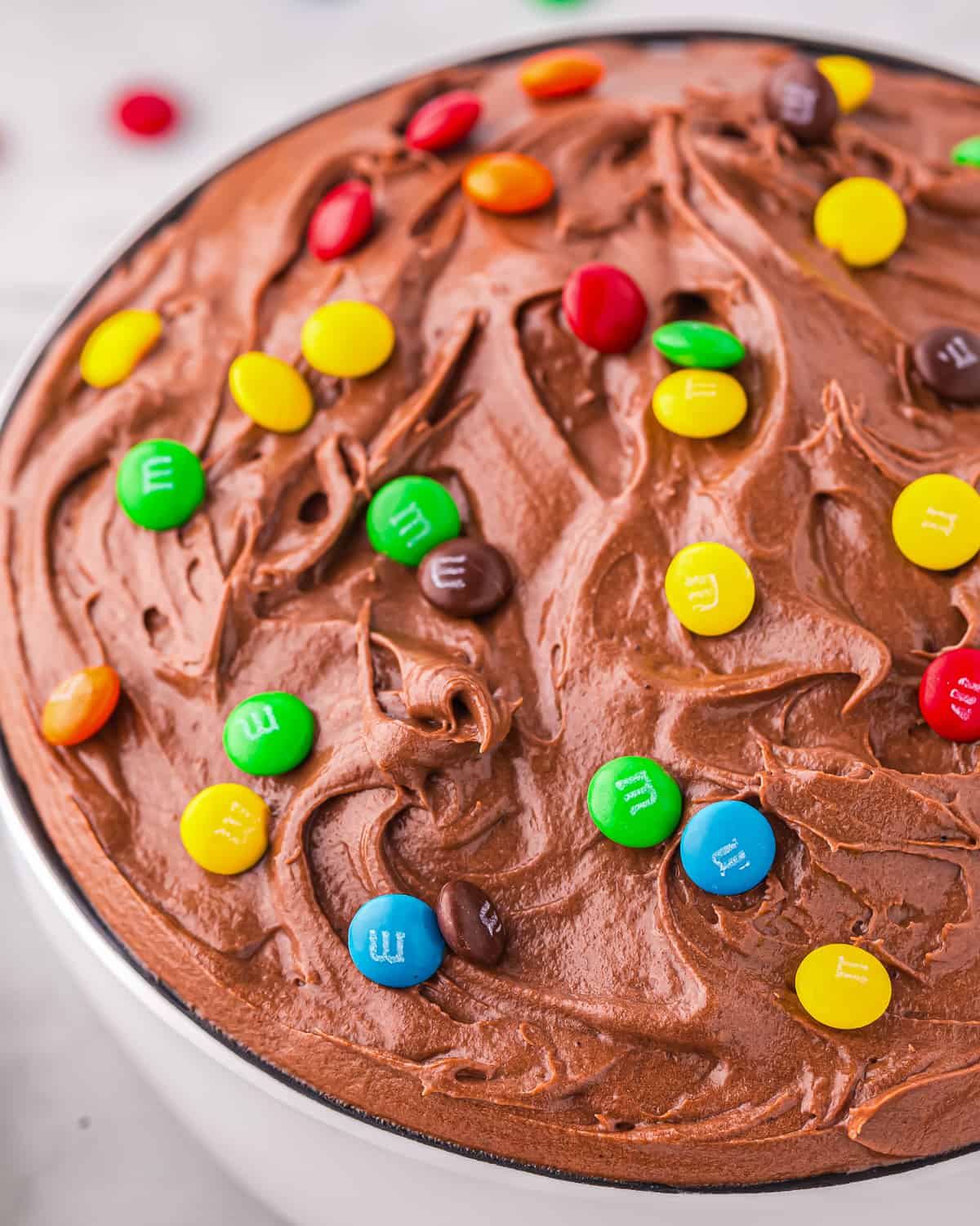 Close up on a bowl of chocolate brownie mix dip.