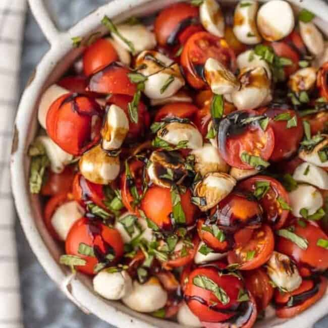 Chopped Caprese Salad is the perfect easy side dish for any BBQ! Simple, delicious, and healthy! Tomato, Mozzarella, Basil, and Balsamic Vinegar. A family favorite! This Caprese Salad Recipe (Tomato Mozzarella Salad) is my go-to side dish for everything Summer!