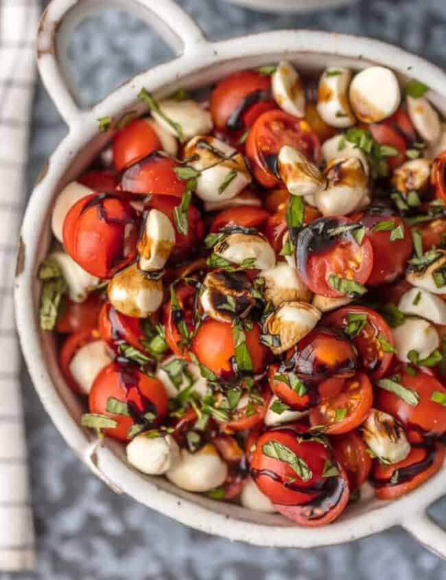 Chopped Caprese Salad is the perfect easy side dish for any BBQ! Simple, delicious, and healthy! Tomato, Mozzarella, Basil, and Balsamic Vinegar. A family favorite! This Caprese Salad Recipe (Tomato Mozzarella Salad) is my go-to side dish for everything Summer!