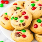 A plate of cookies with m & m's on it.