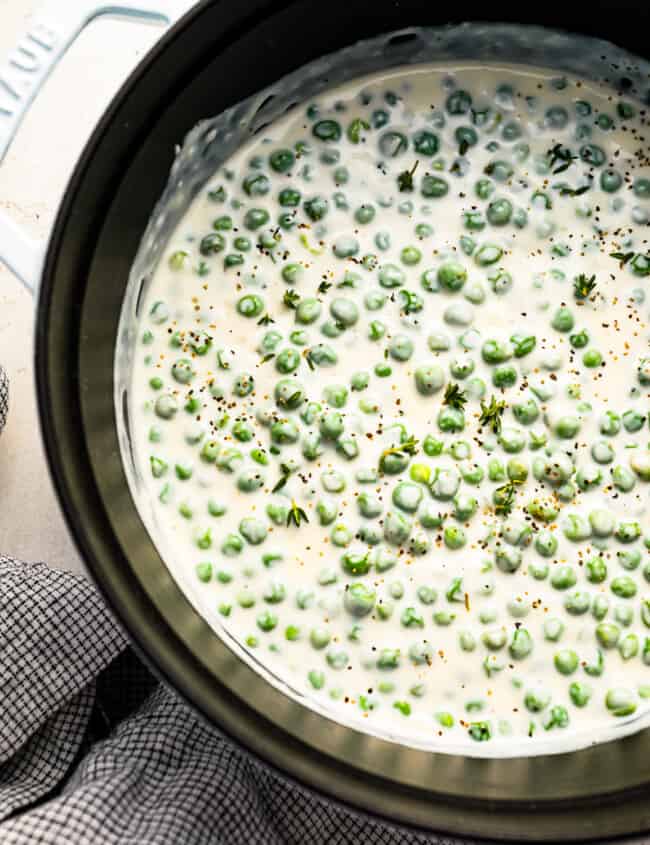 A pot with peas in it.
