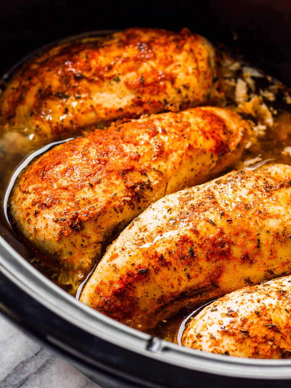 seasoned chicken breasts cooked in a crockpot.