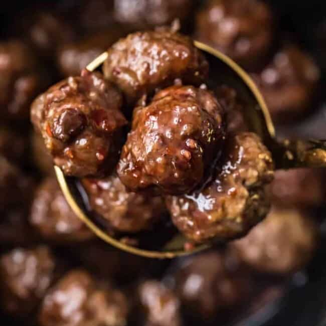 grape jelly meatballs in a spoon