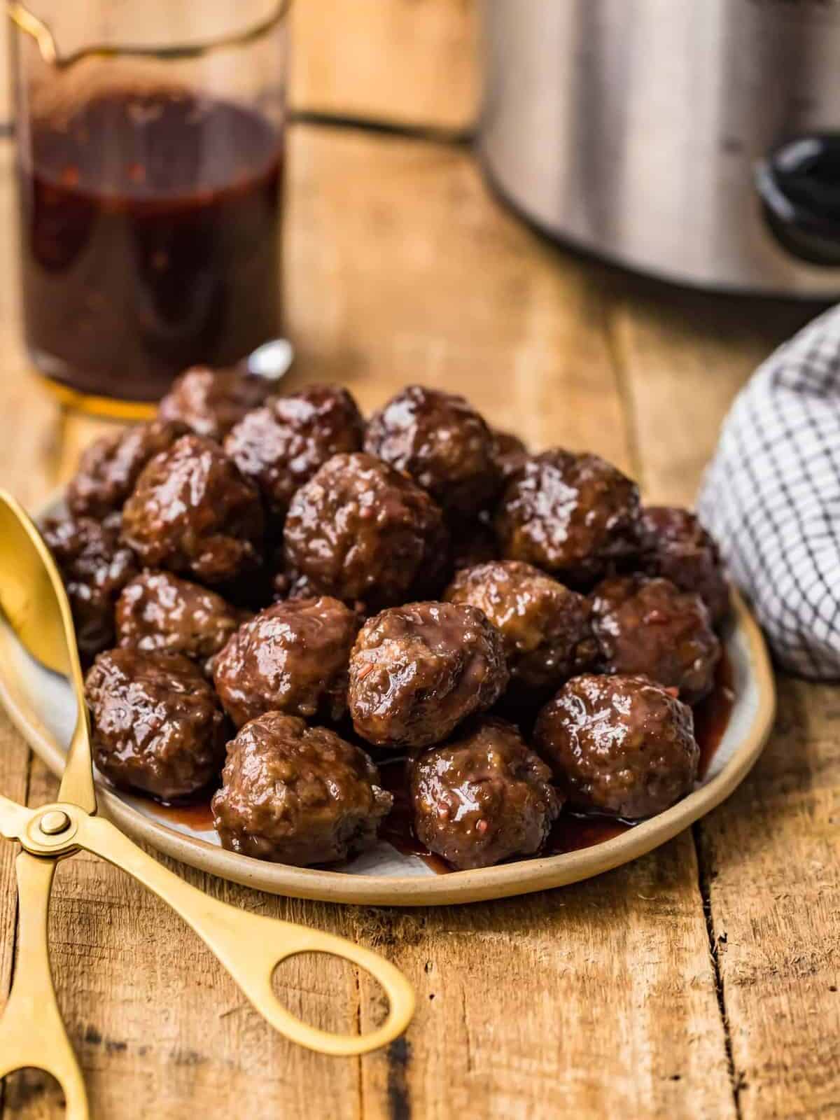 Grape jelly meatballs served on a plate.