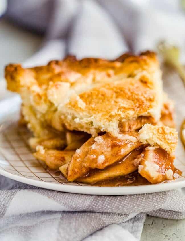 Homemade Apple Pie is one of the coziest, homiest desserts I can think of! Fresh, warm apple pie from scratch (with homemade apple pie crust) is the ideal Thanksgiving dessert. This easy homemade apple pie recipe makes it simple to bake a fresh pie for any occasion!