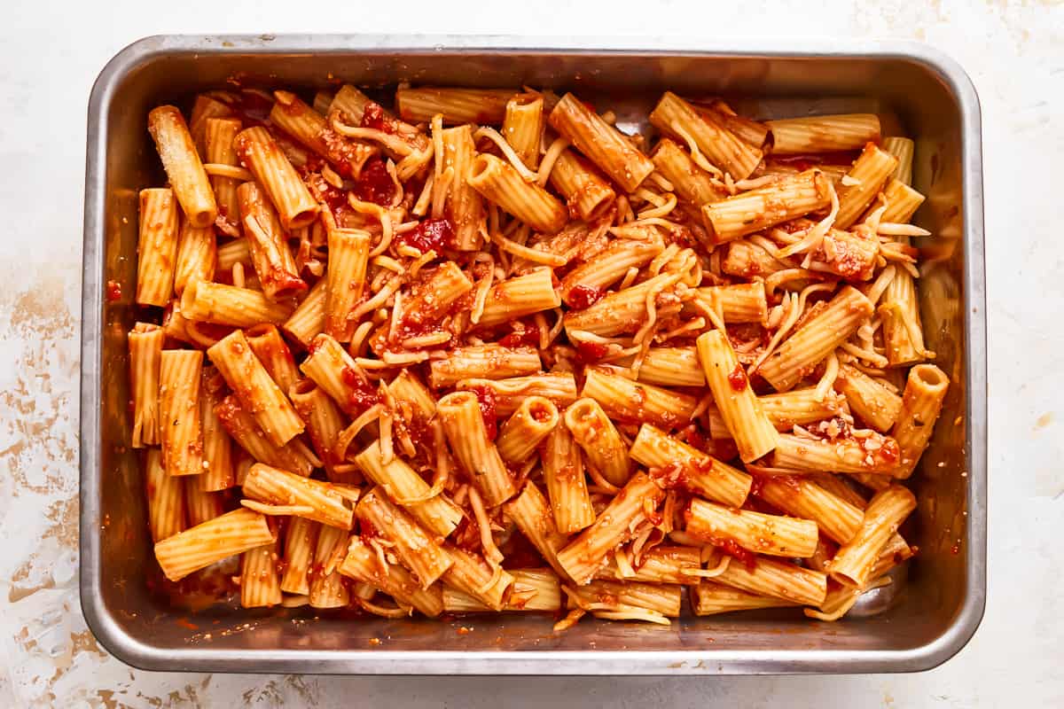 Penne pasta with tomato sauce in a pan.