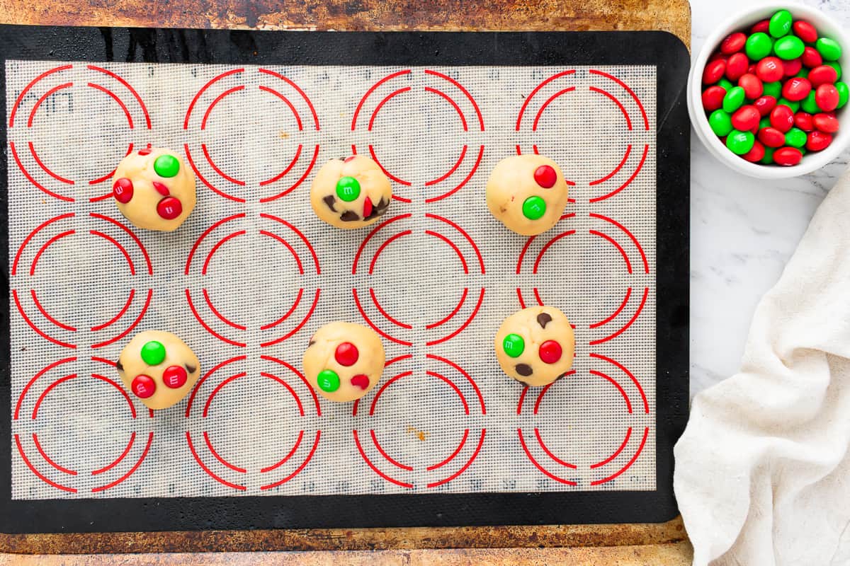 A baking sheet with cookies and candy on it.
