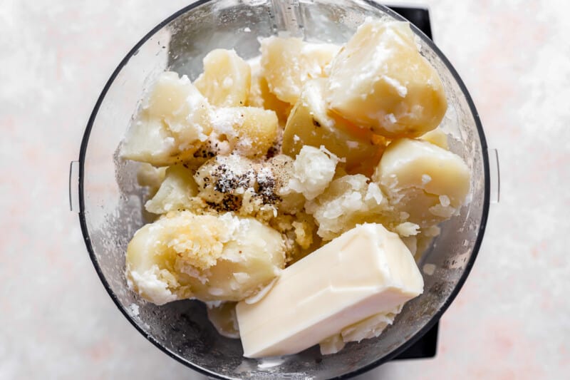 Mashed potatoes and butter in a food processor.