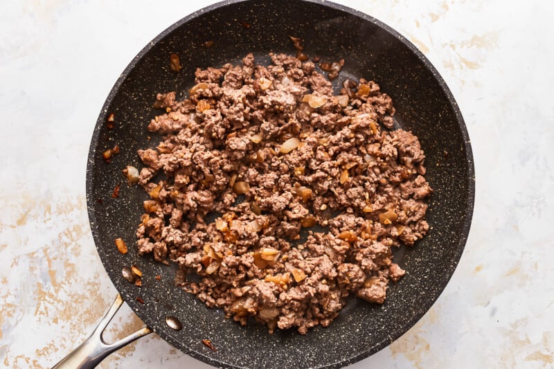 Ground beef in a frying pan.