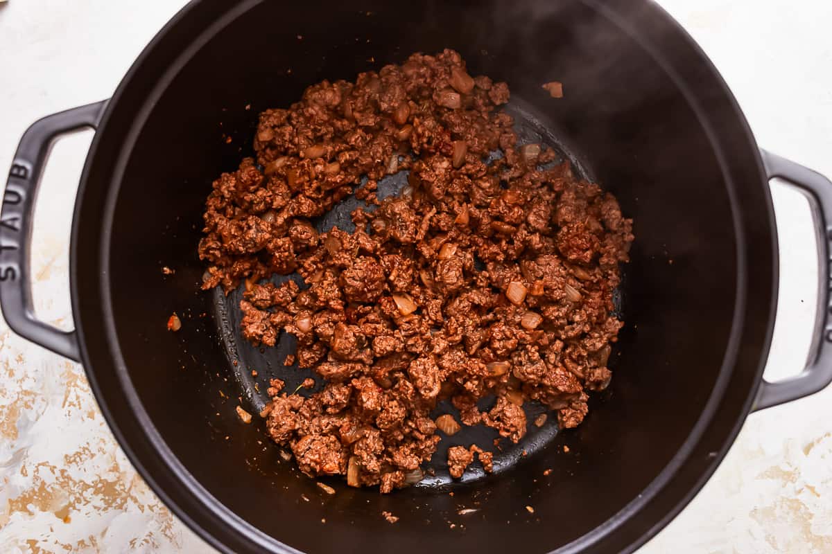 A pot of ground beef cooking in a pan.