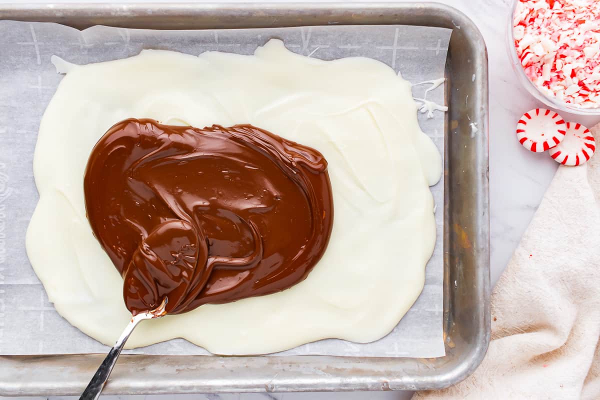 A pan with chocolate and candy canes on it.