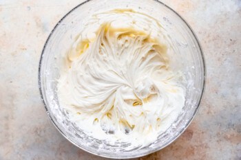 Whipped cream in a glass bowl.