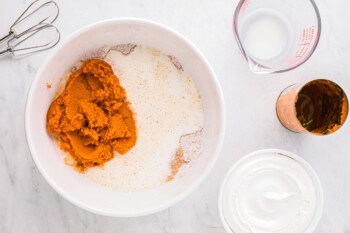 A bowl of ingredients for a pumpkin pie.