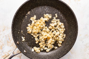 Fried onions in a frying pan.