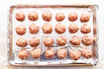 Meatballs on a baking sheet.