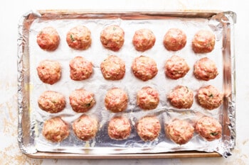 Meatballs on a baking sheet.