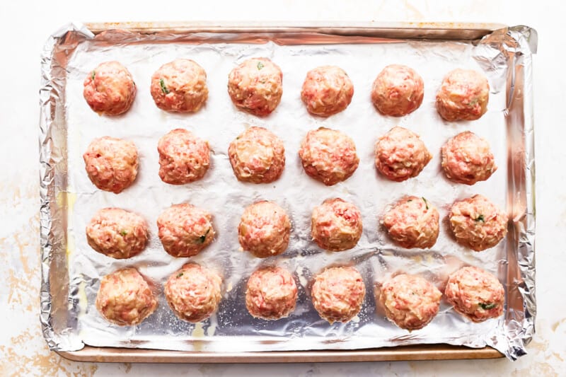 Meatballs on a baking sheet.