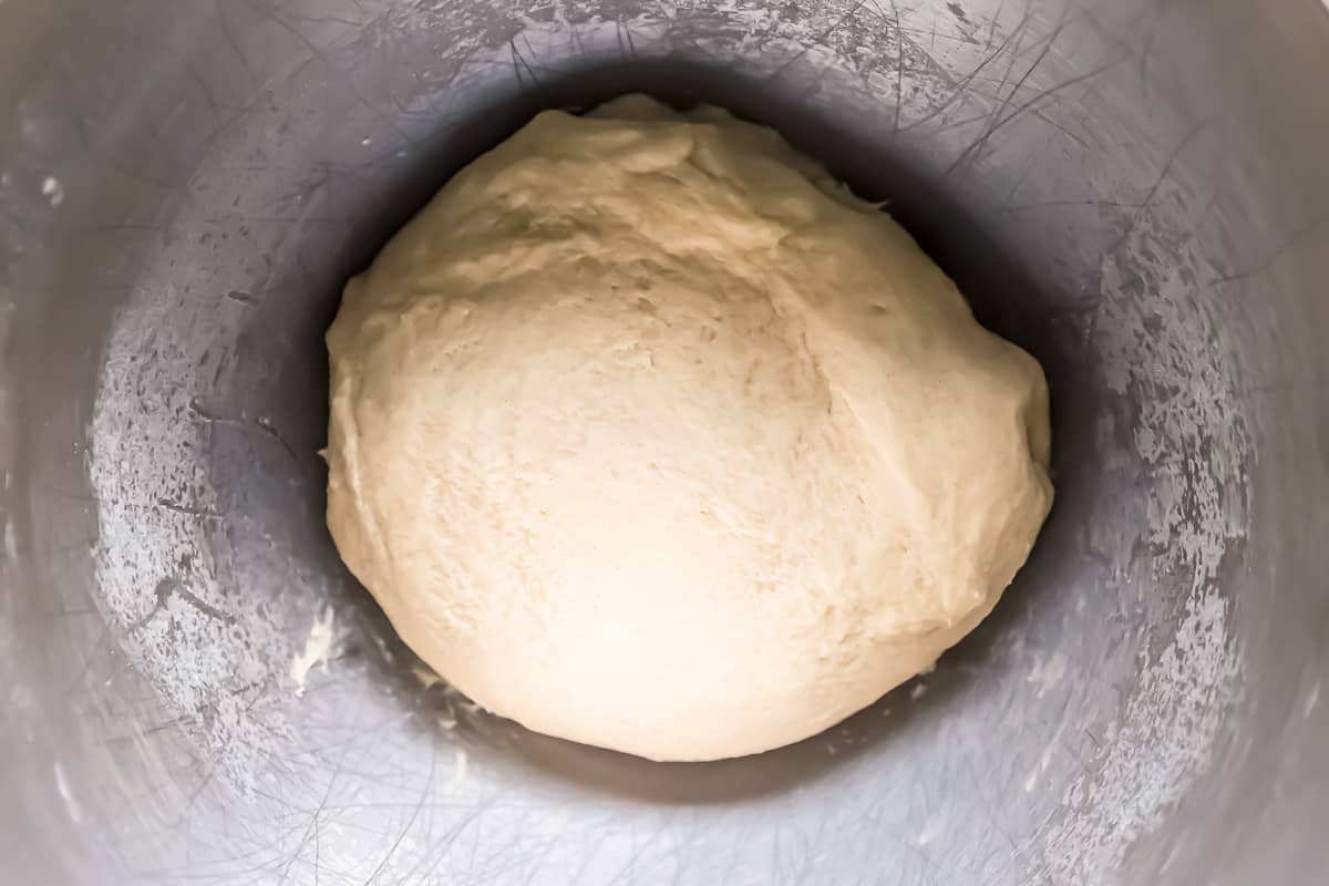 A dough ball in a mixing bowl.