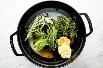 A pot filled with herbs and spices.