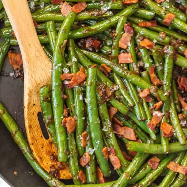 These SKILLET BOURBON BACON GREEN BEANS add some spice, flair, and beauty to any holiday table! The ultimate Thanksgiving side dish SO full of flavor, you'll be blown away!