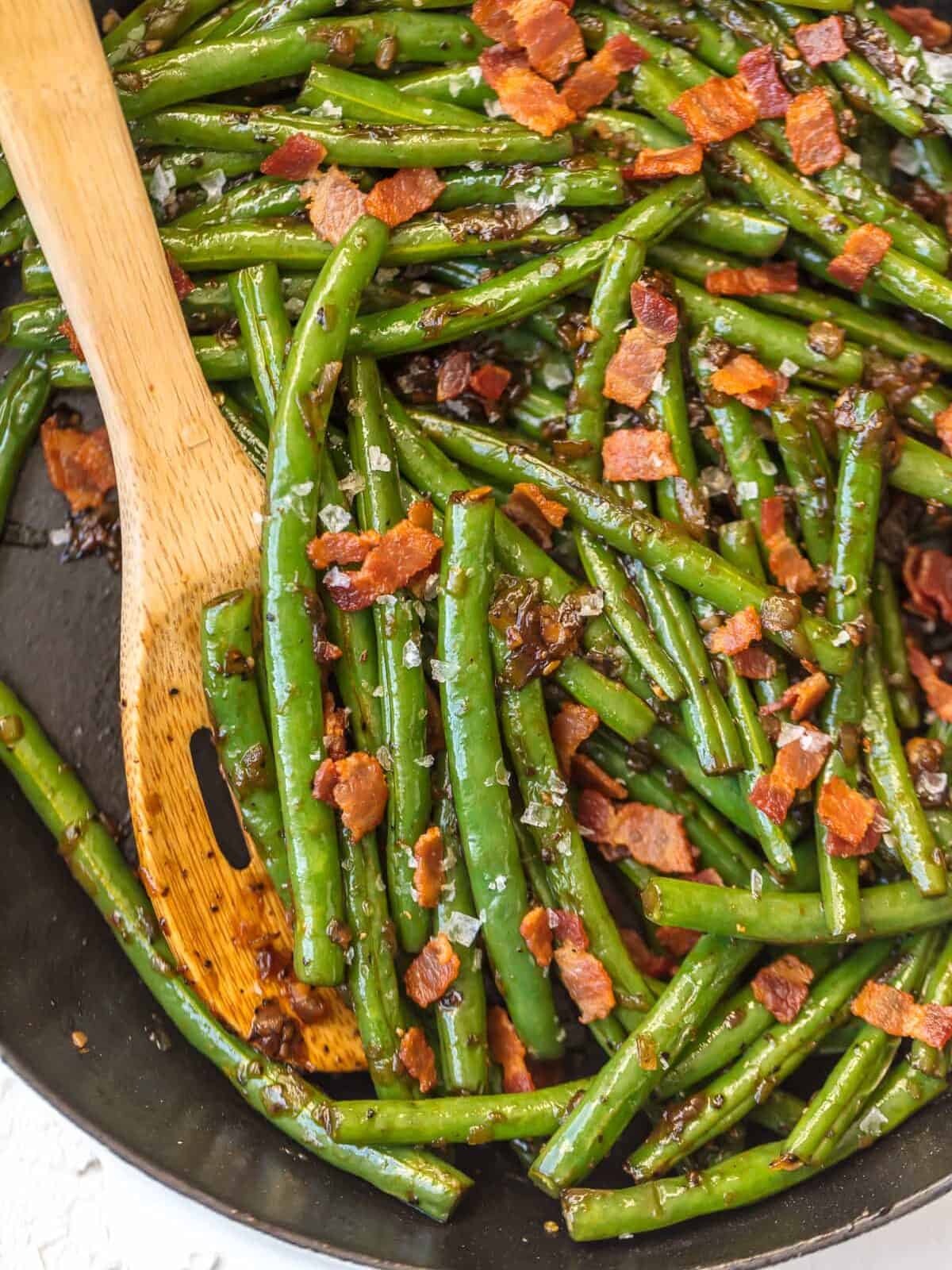 skillet green beans with bacon, bourbon, garlic, brown sugar, and onions.