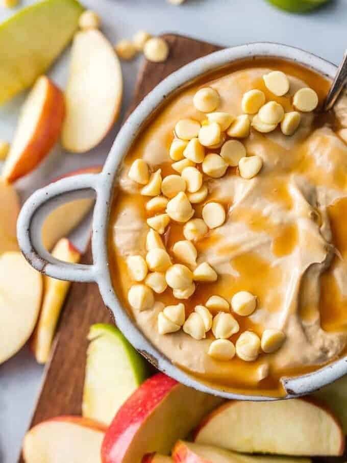 Caramel Apple Dip with apples surrounding it