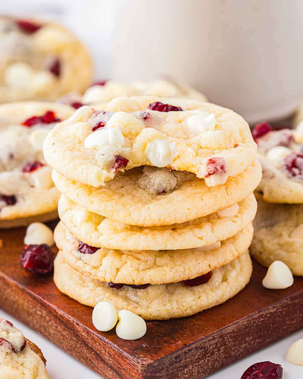 A stack of cookies on a cutting board.