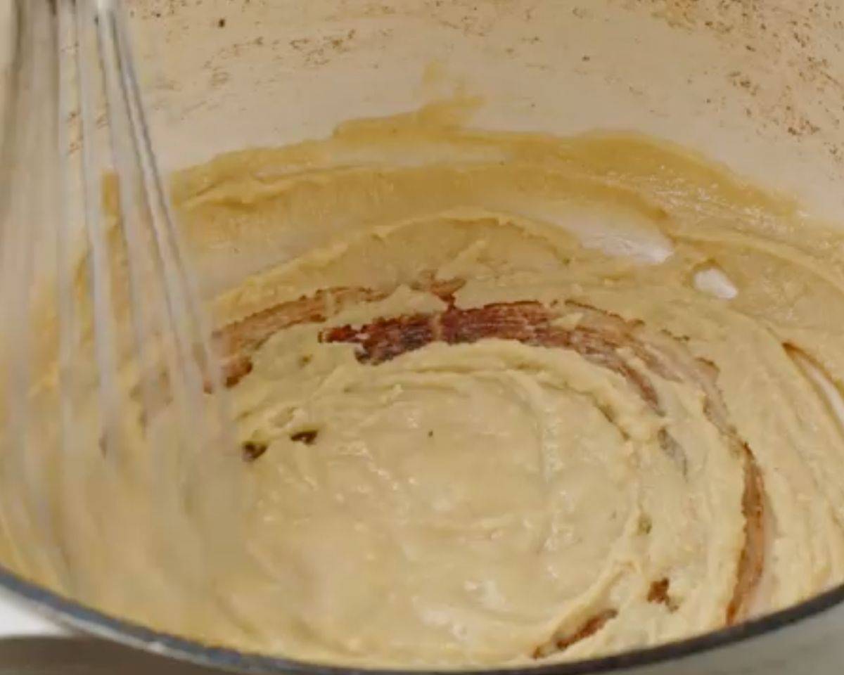 Butter and flour roux cooking in a Dutch oven until thick and smooth - 9