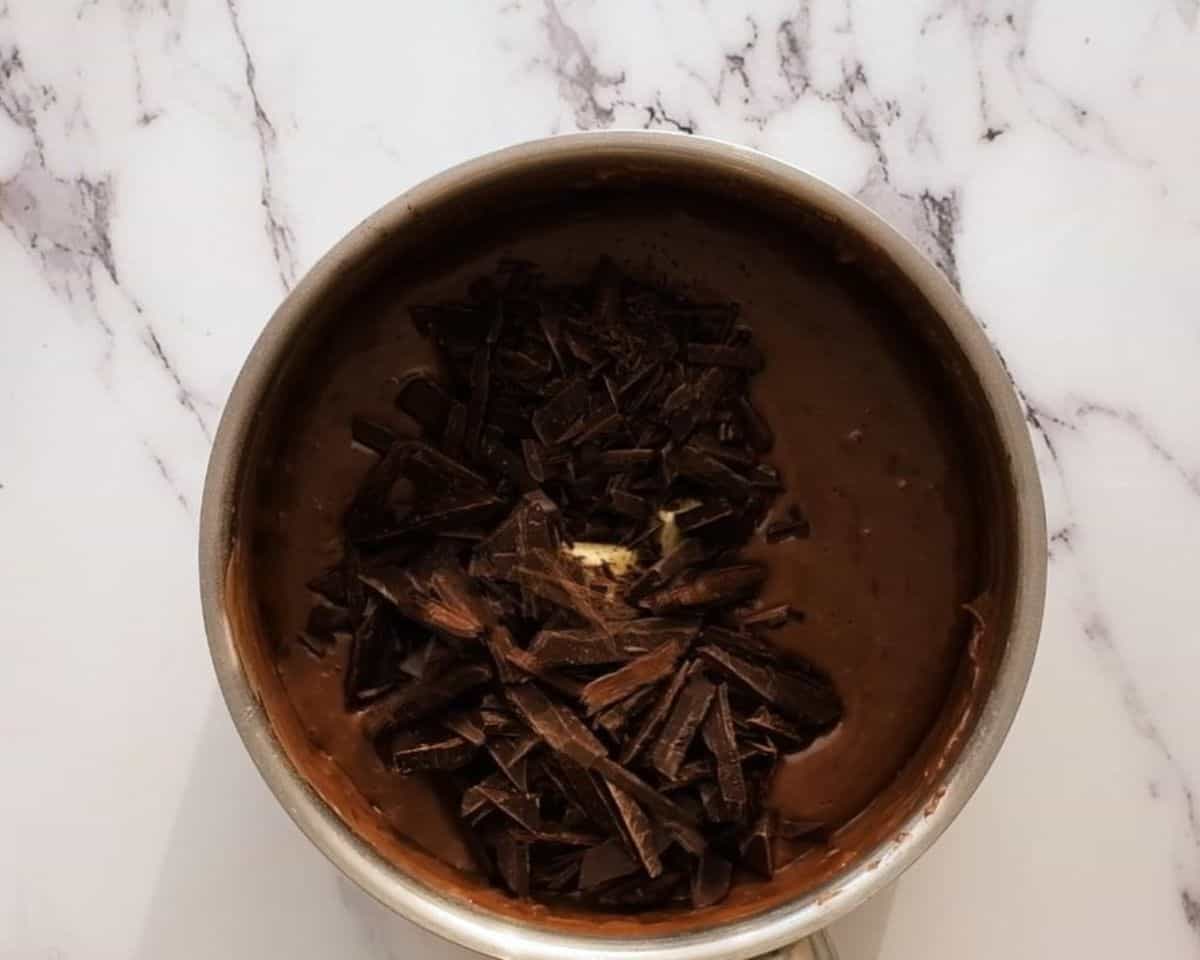 Adding butter and chocolate to the mixture. - 8