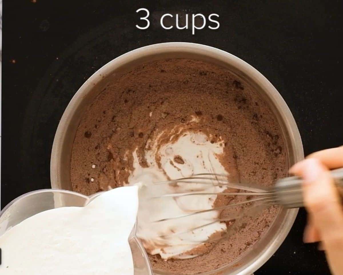 Adding half and half to the mixture. - 7