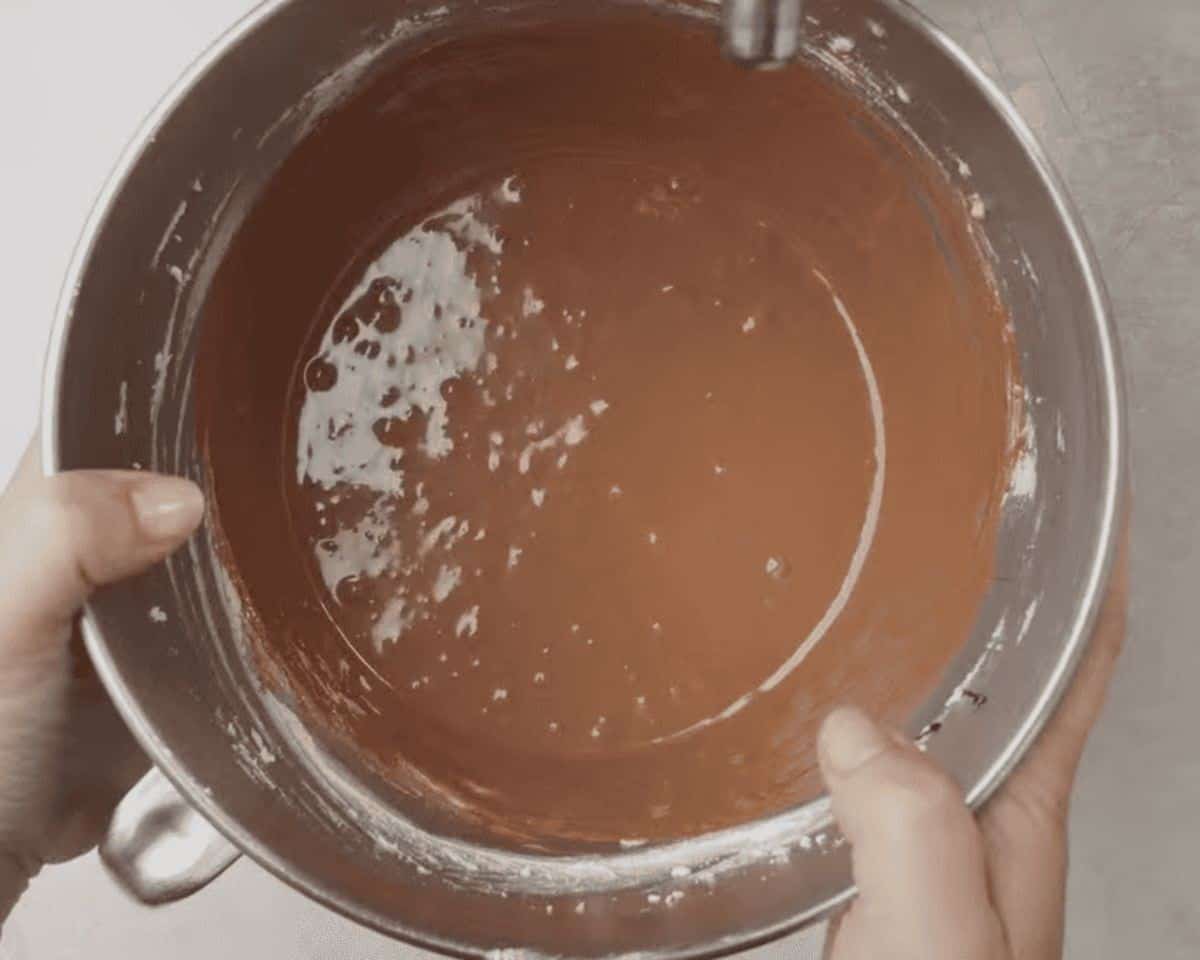 Chocolate pie filling in a stainless steel bowl.