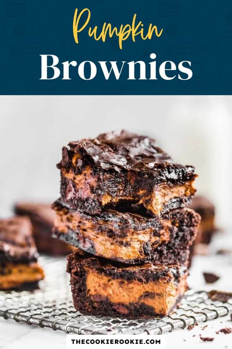 Pumpkin brownies stacked on top of each other.