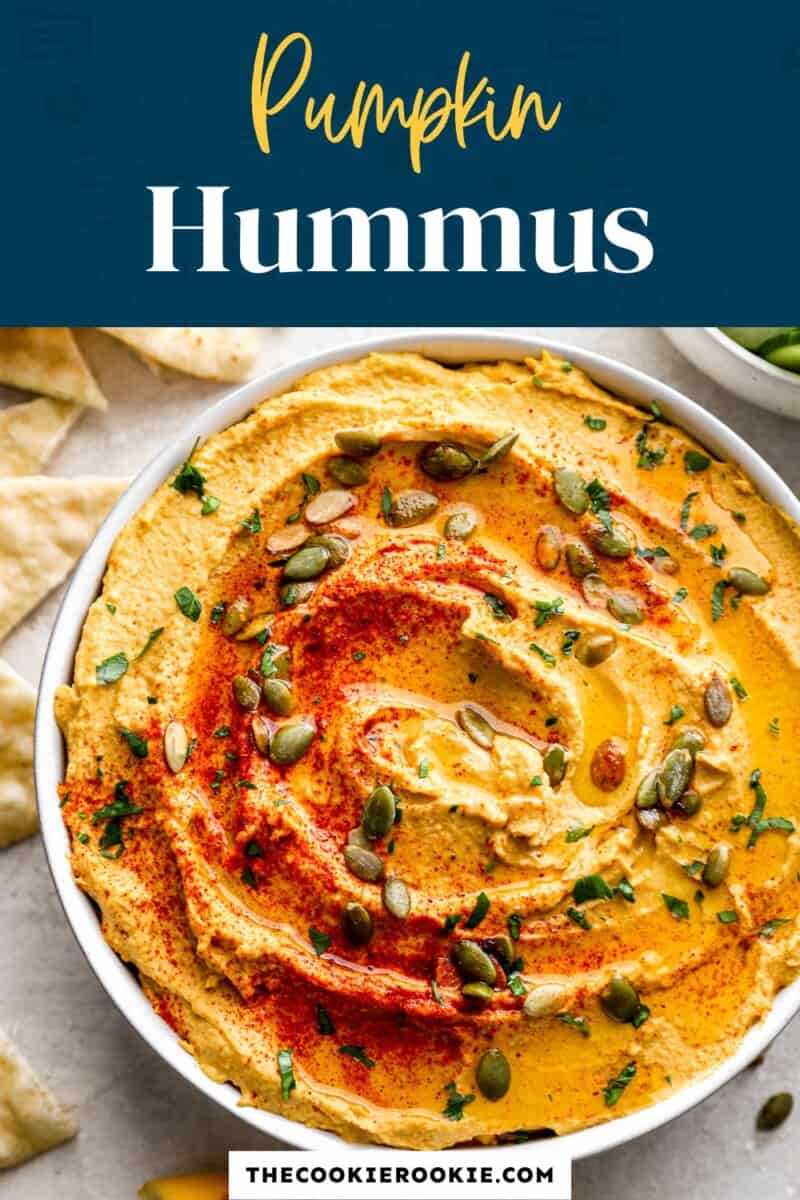 Pumpkin hummus in a bowl with toppings.
