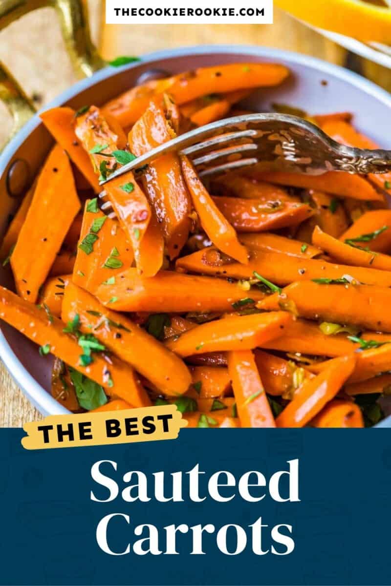 Sauteed carrots in a pan with a fork.