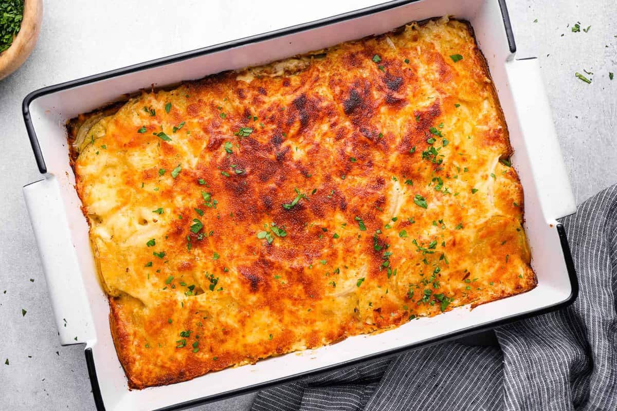 overhead view of au gratin potatoes in a 9x13 baking pan.