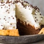 creamy chocolate pie with a ton of whipped cream on top