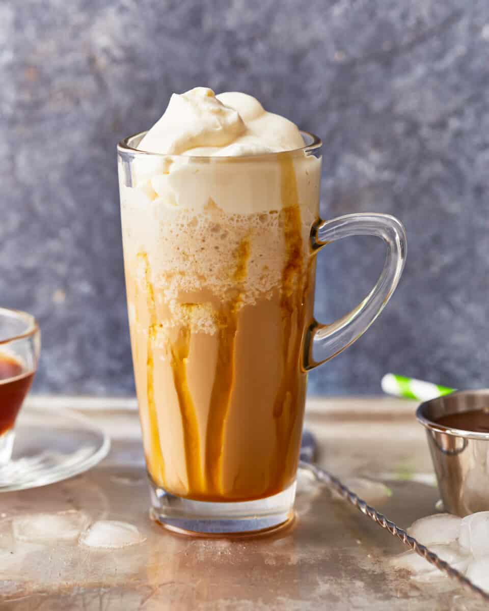 A homemade Caramel Frappuccino with whipped cream and caramel.