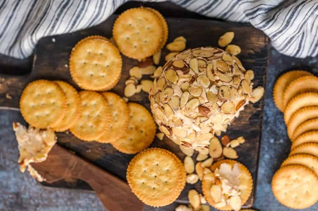 Wood board with a cheese ball and crackers