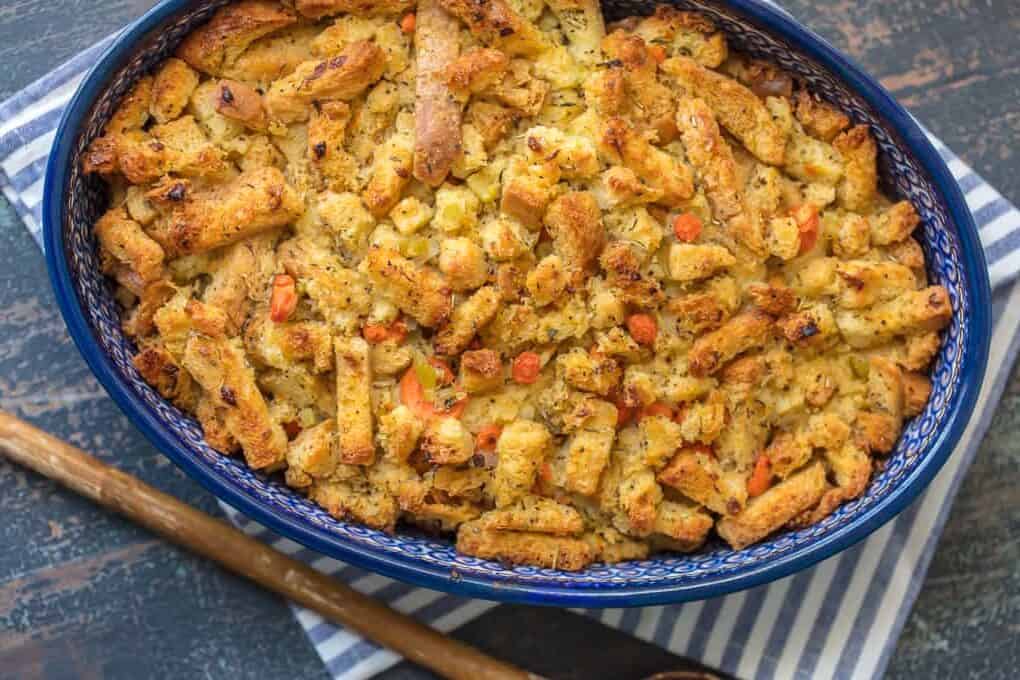 homemade stuffing in a blue baking dish.