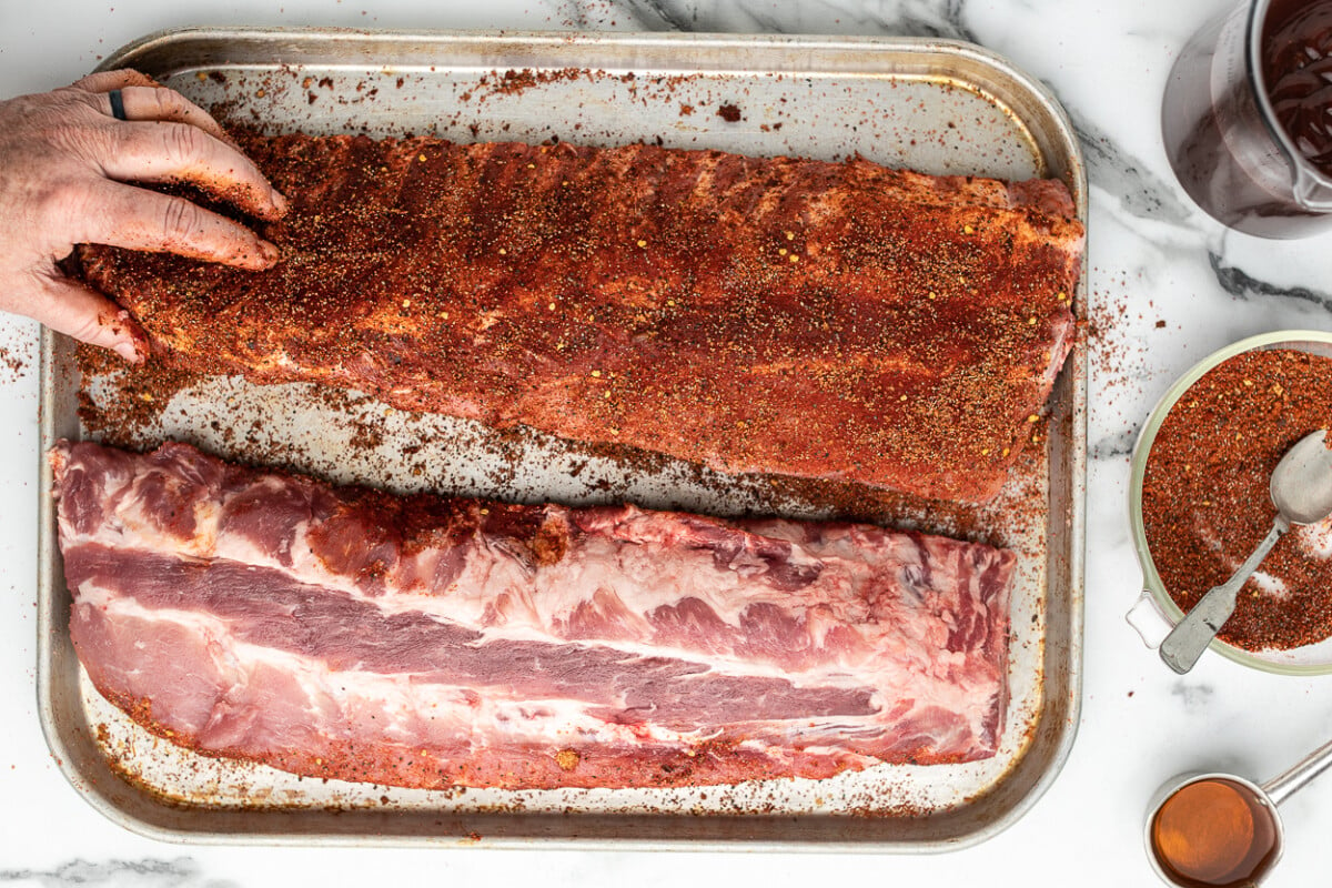 Slow cooker bbq ribs on a baking sheet.