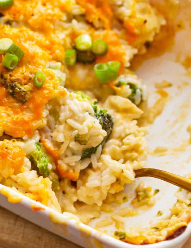 A casserole dish filled with broccoli cheese rice casserole.