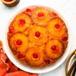 A pineapple upside down cake on a plate.