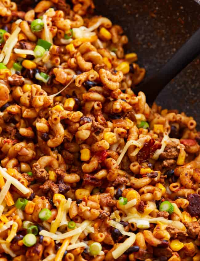 A skillet filled with taco mac and cheese.