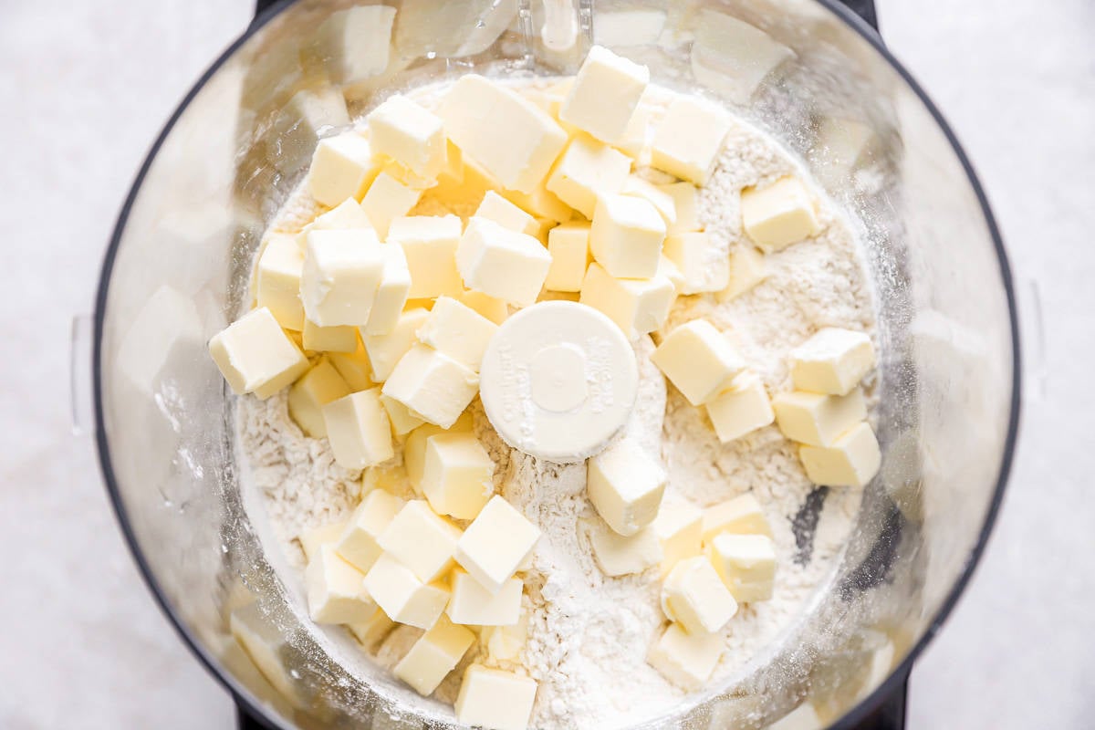 Butter cubes in a food processor.