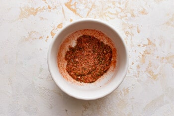 A white bowl filled with a mixture of spices.