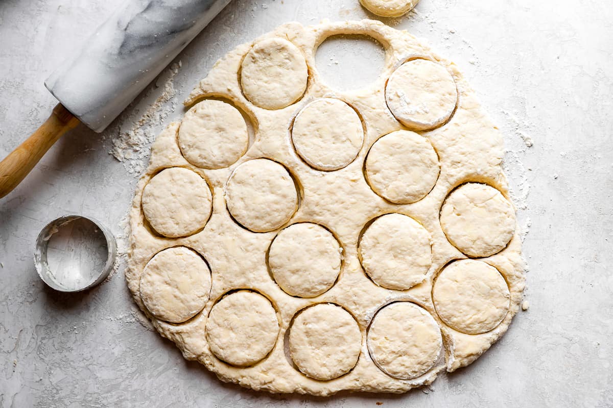 A tray of cookies with a rolling pin and a rolling pin.