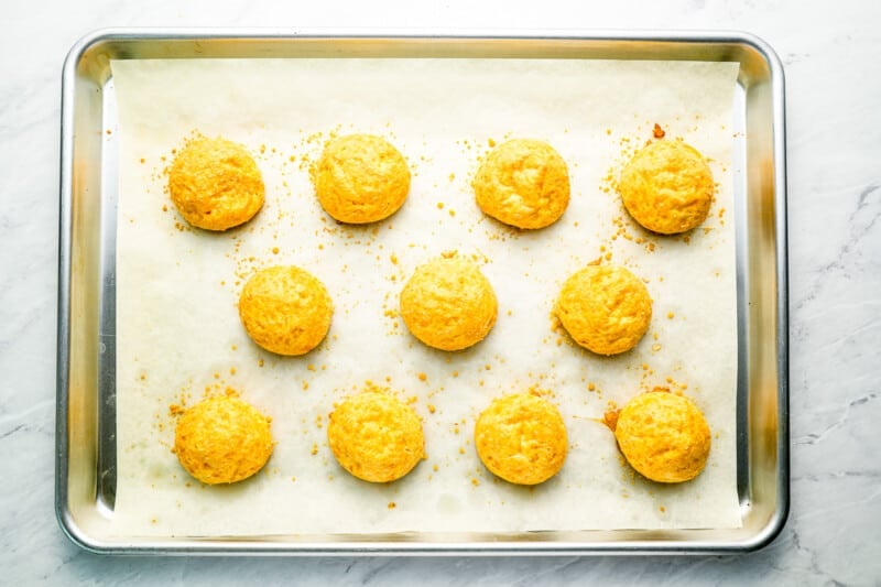 baked cheese puffs on a tray.