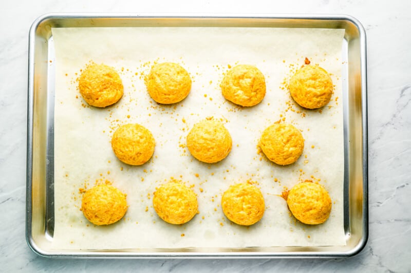 baked cheese puffs on a tray.