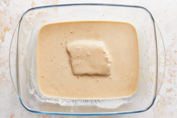 A square of batter in a glass baking dish.