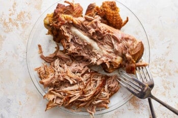 Shredded turkey meat on a plate with a fork.